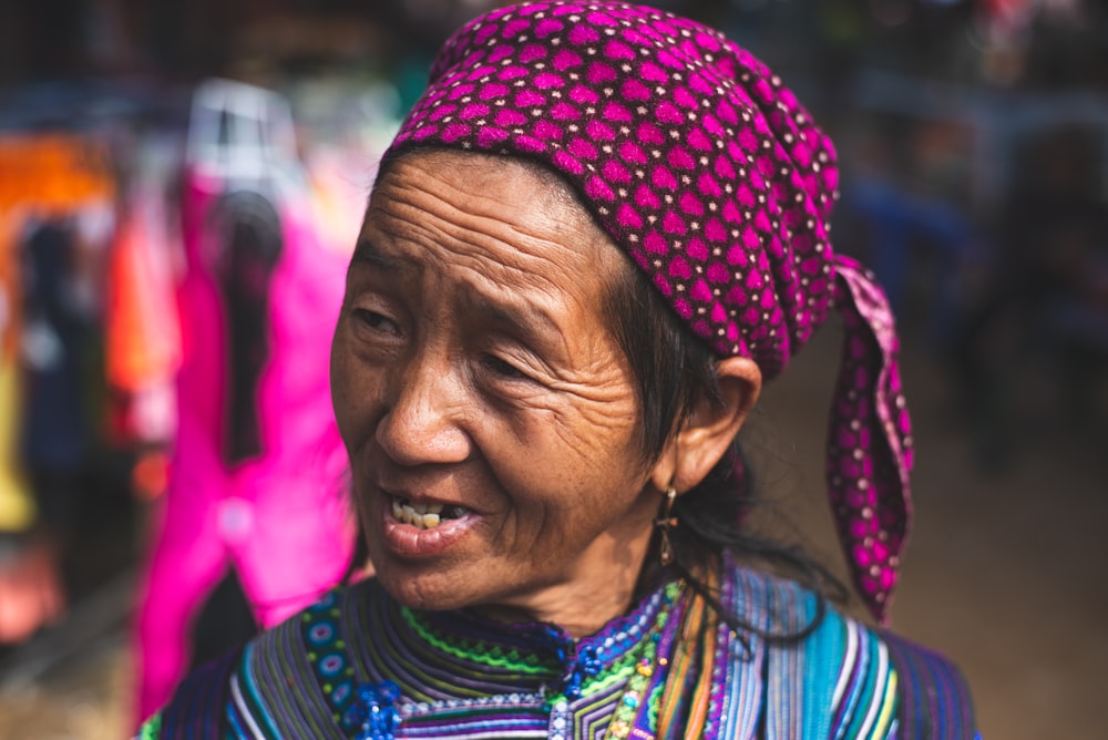 shallow focus photo of woman wearing purple headdress