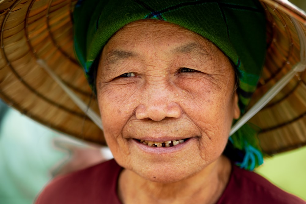 smiling woman wearing straw hat