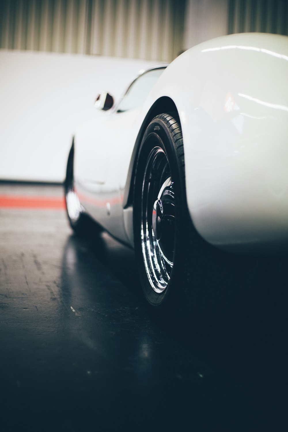 white car parked near wall