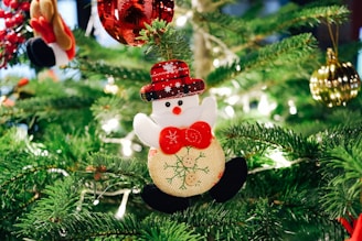 selective focus photography of snowman Christmas ornament