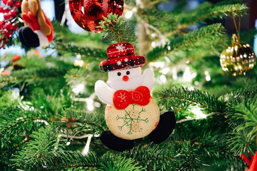 selective focus photography of snowman Christmas ornament