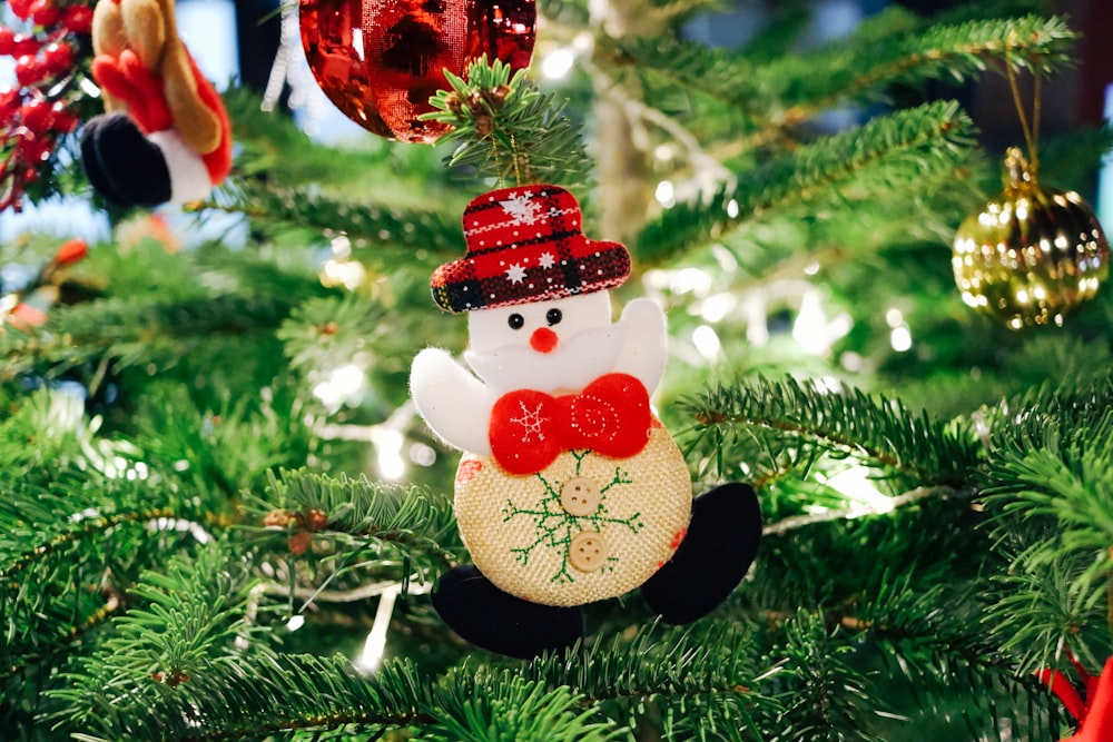 selective focus photography of snowman Christmas ornament