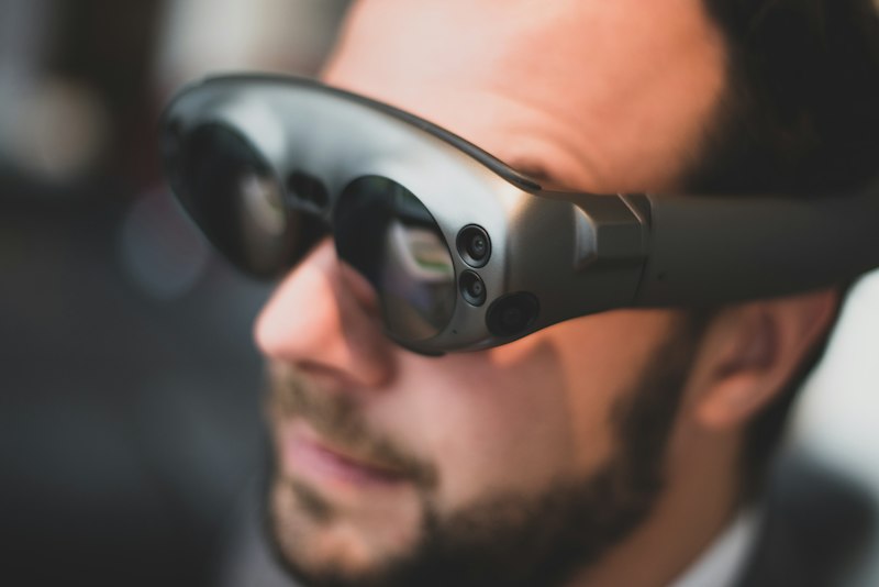 Person wearing smart glasses with integrated technology â representing Google x Warby Parker AI eyewear
