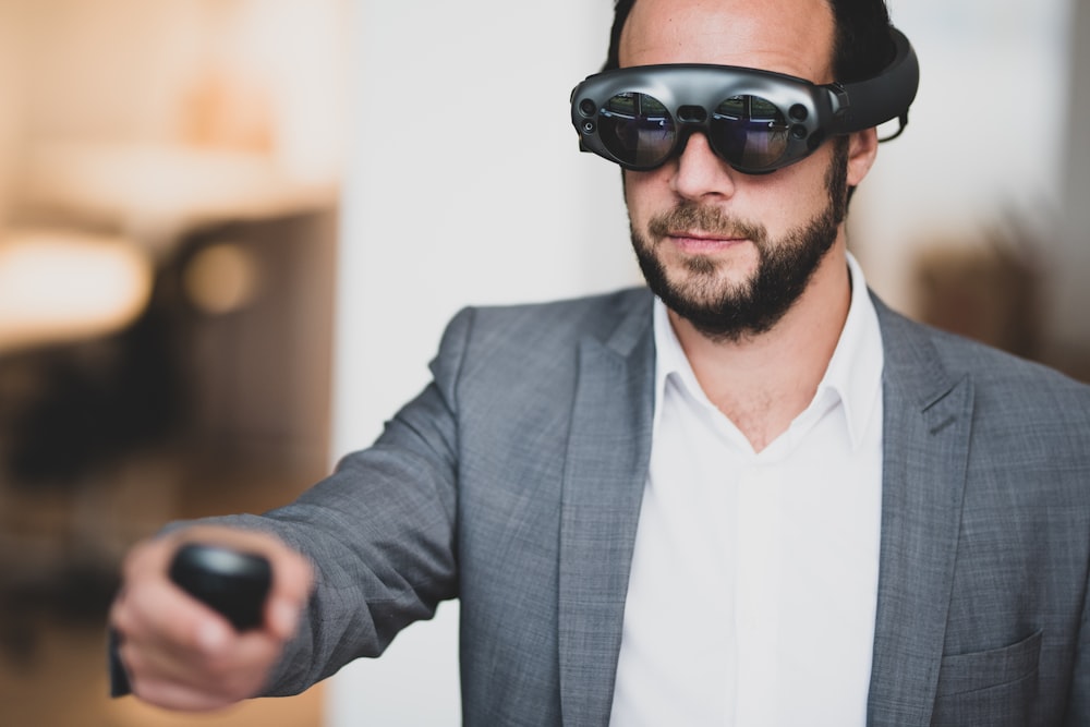 man wearing VR box and holding remote control