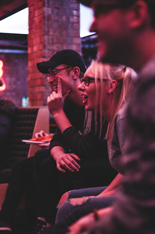 A group of teenagers engaged in improvisation exercises, laughing and focused.