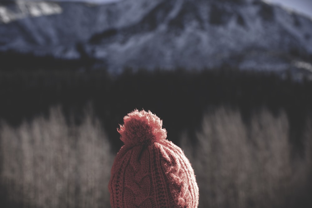 selective focus photography of pink bobble hat