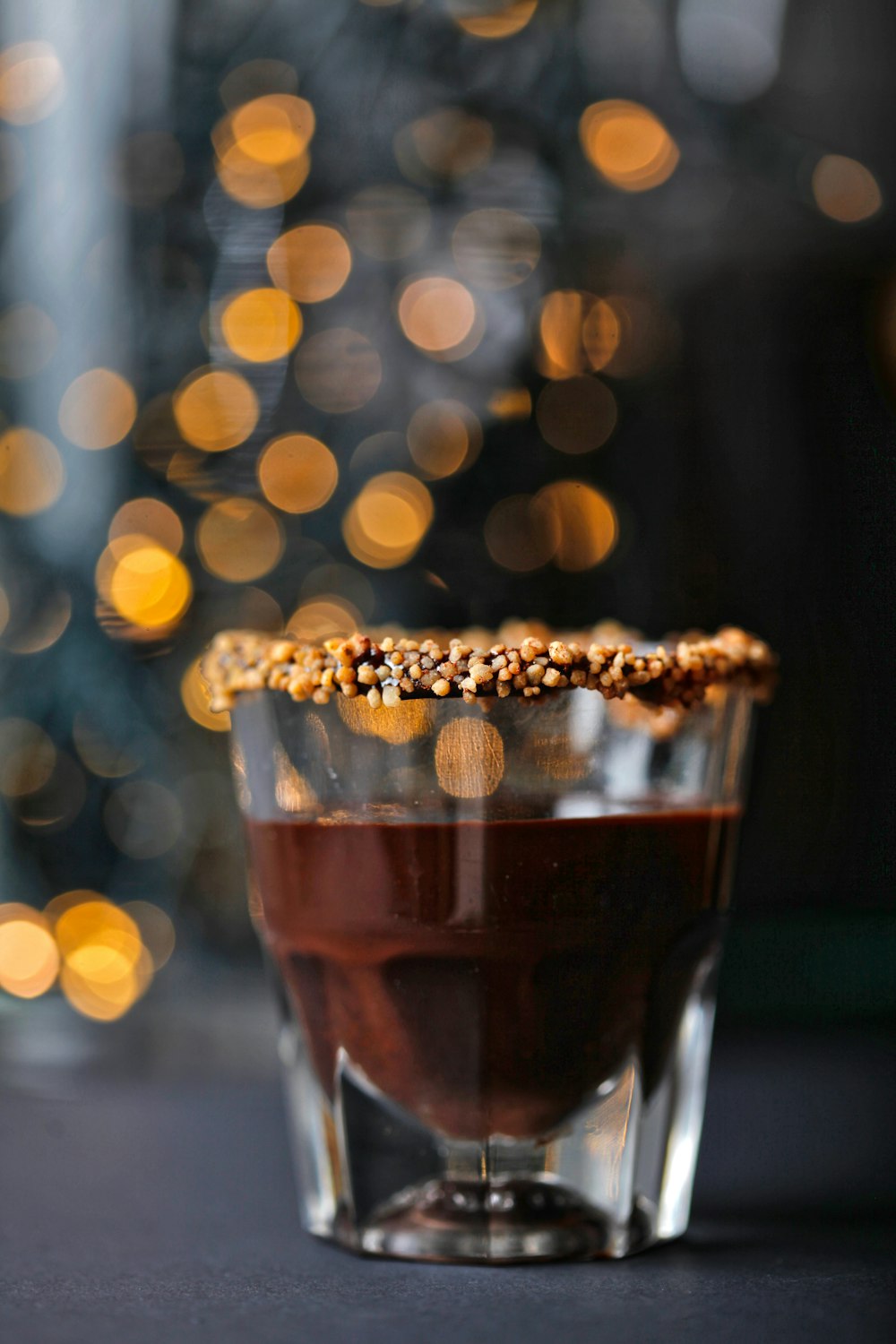 clear drinking glass filled with brown liquid