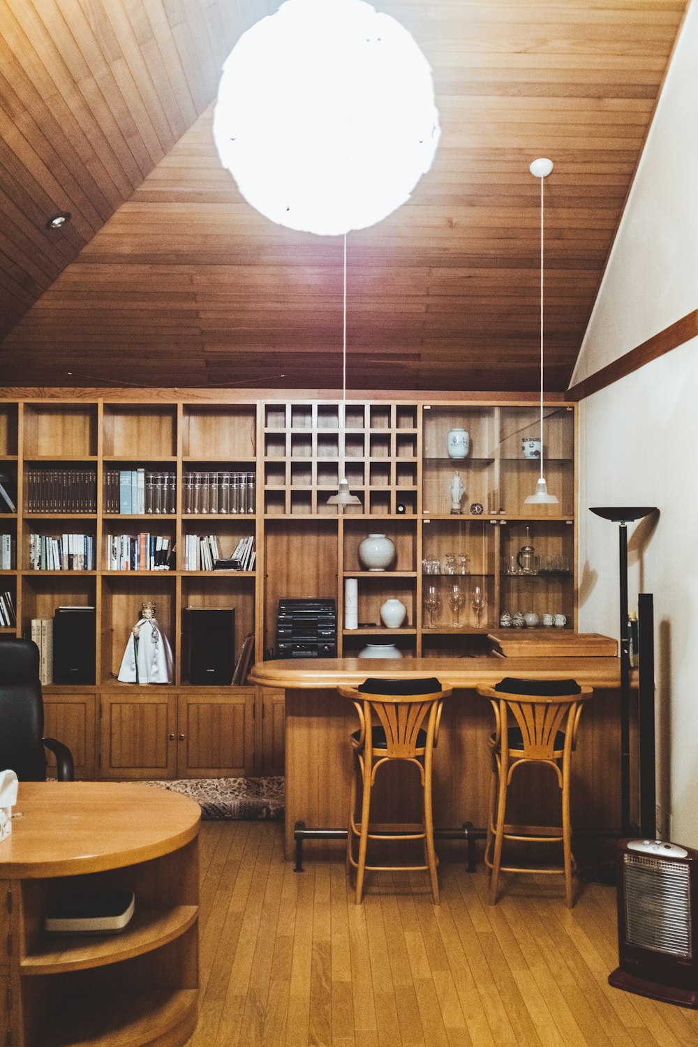 brown wooden table and two chairs