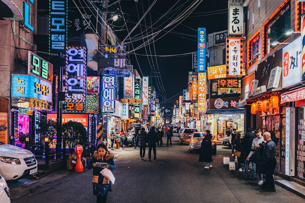 people walking on street at nighttime