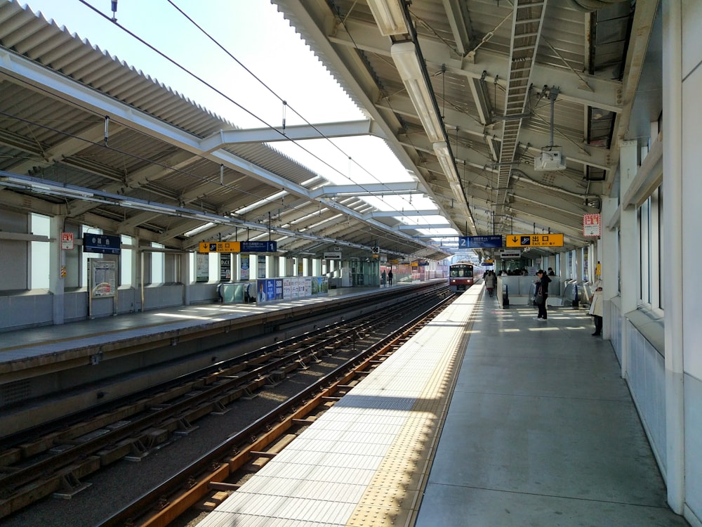 people standing at the train station