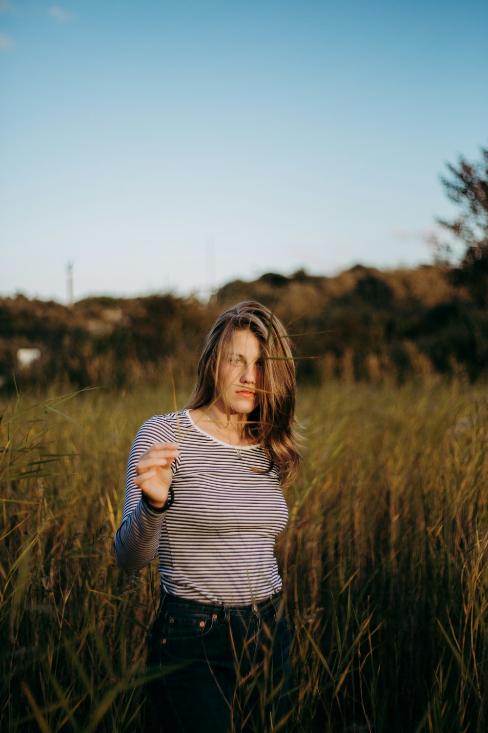 woman surrounded by grass