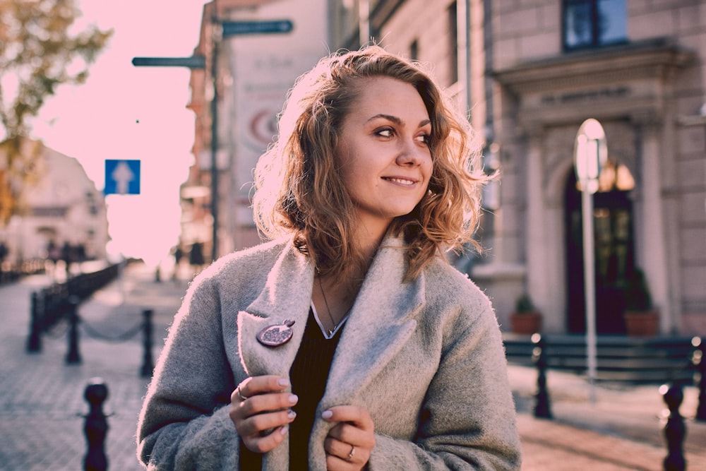 woman holding coat