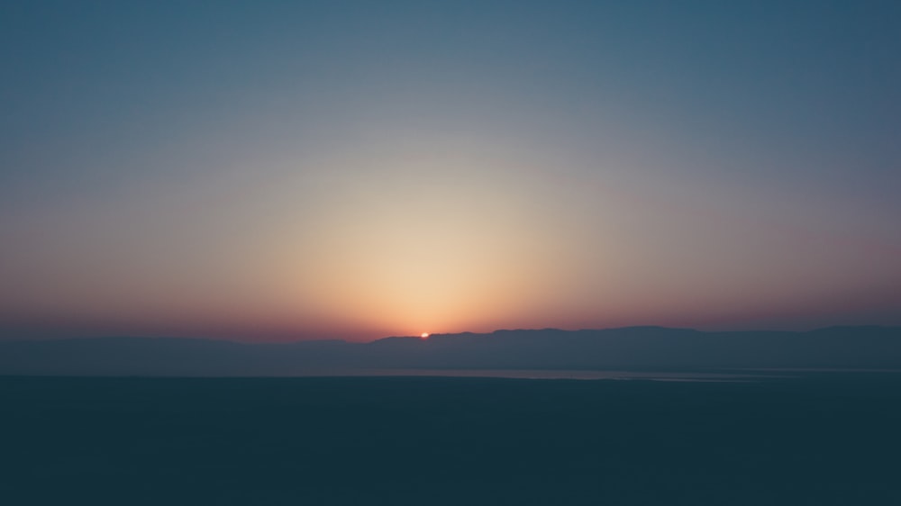 silhouette of sea and mountains