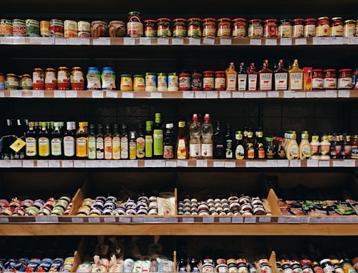 assorted-labeled bottle display on rack