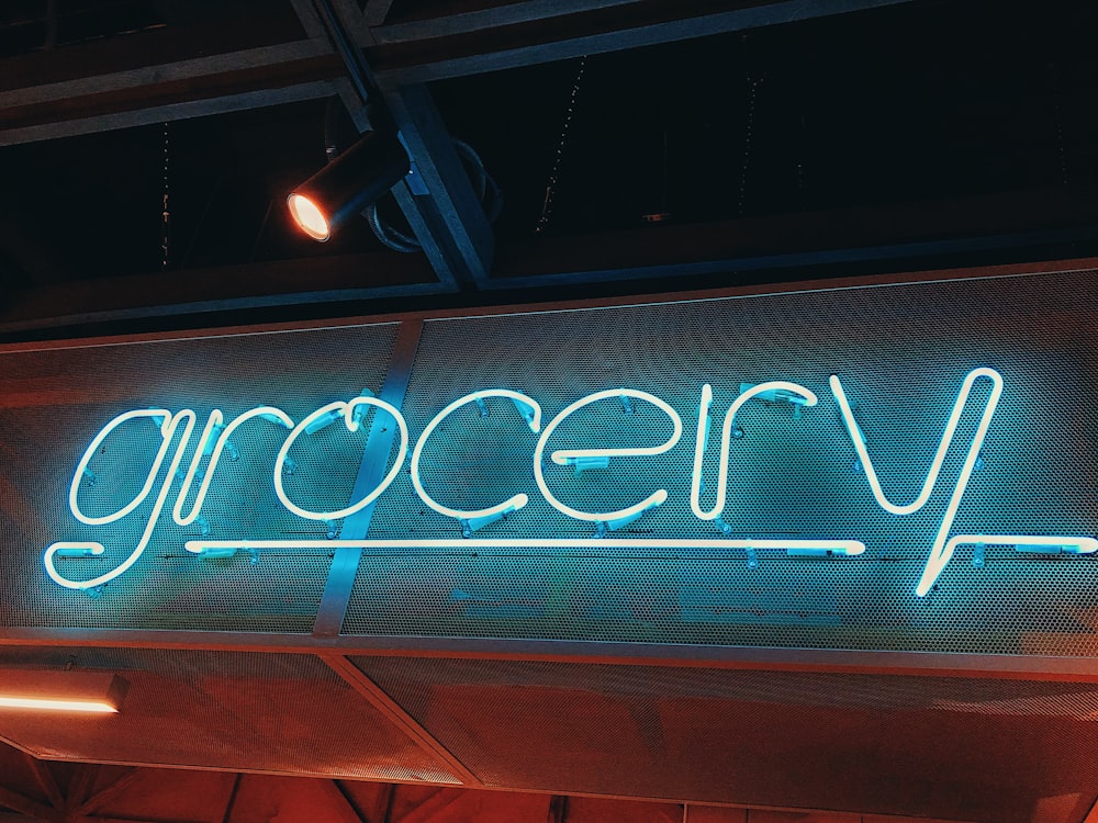 white grocery neon sign