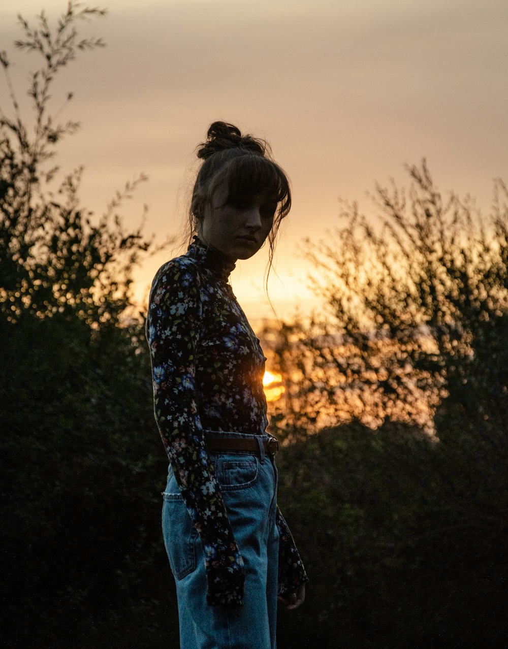 woman standing near plant