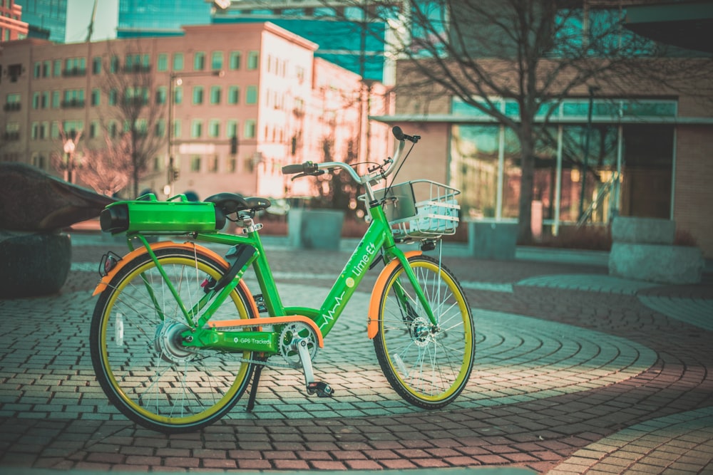 selective focus photography of green step-through bicycle
