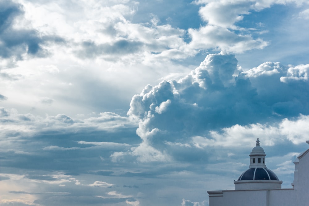 white tower building under cloudy sky