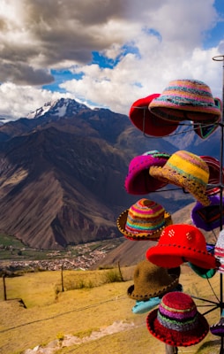 assorted-color hats on rack wallpaper