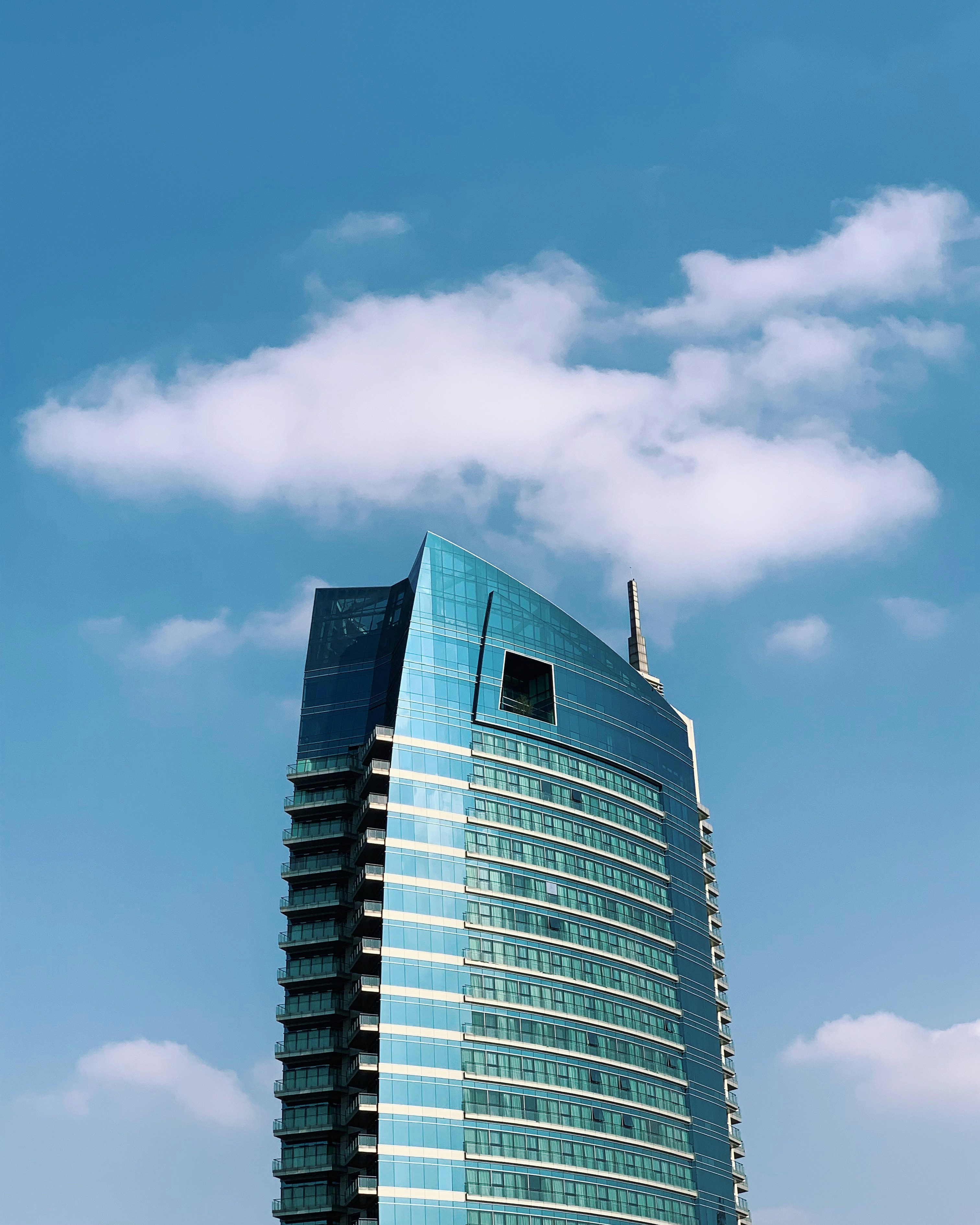 blue high-rise building during daytime