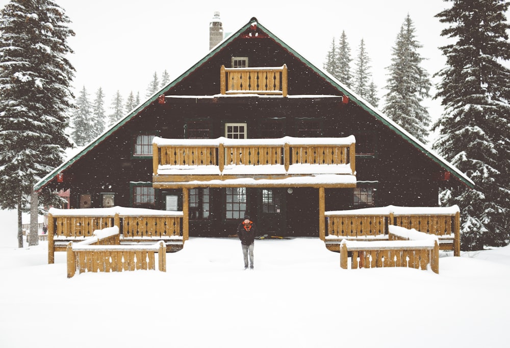 people standing beside house