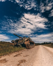 grey battle tank on road during daytime
