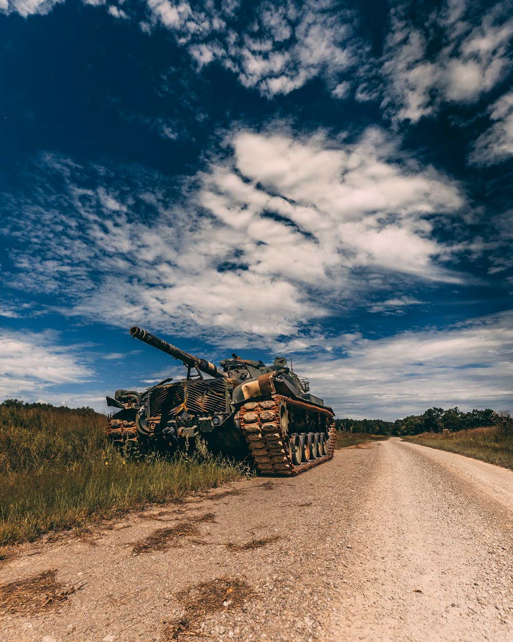 grey battle tank on road during daytime