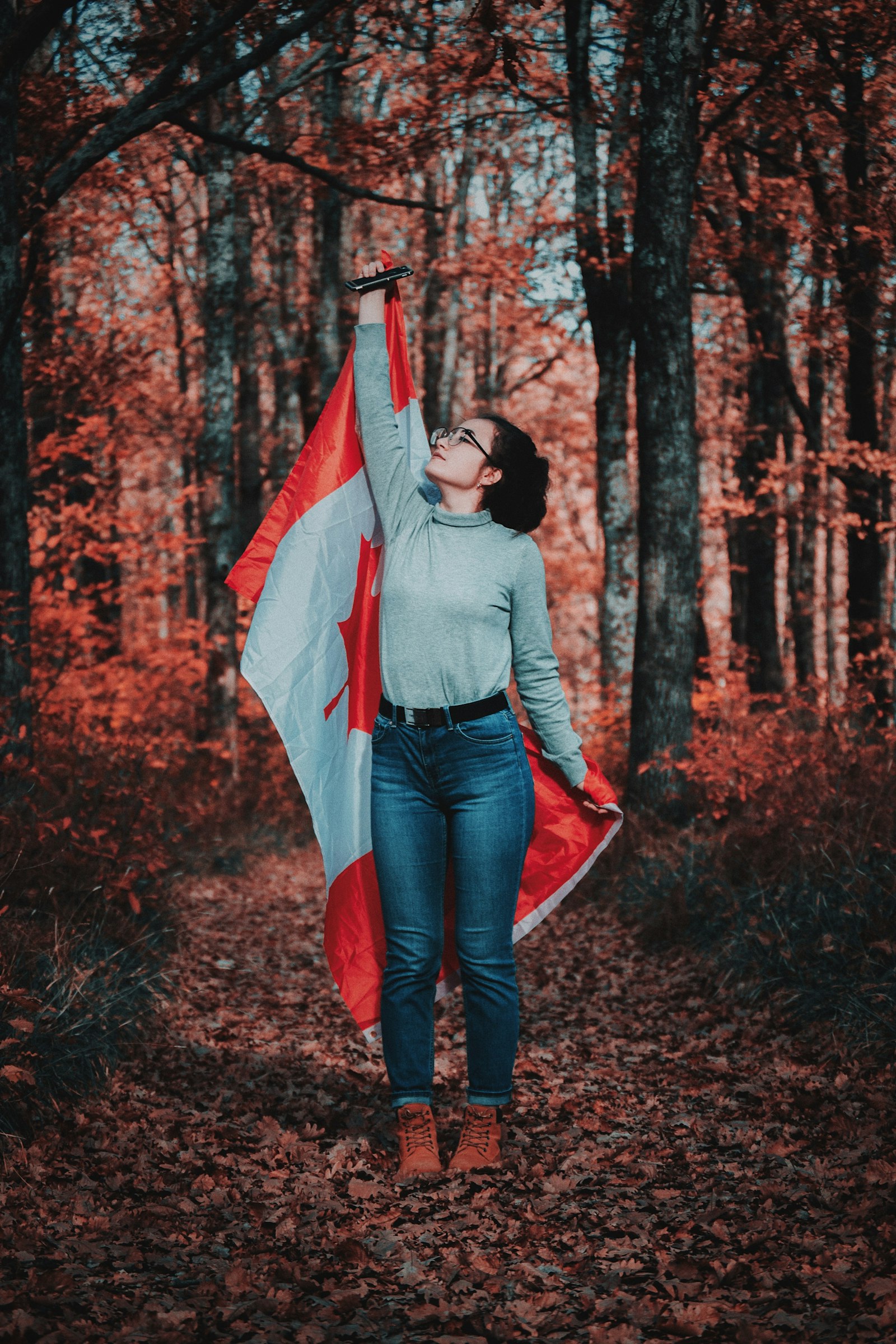 Nikon AF-S DX Nikkor 55-200mm F4-5.6G ED sample photo. Woman holding flag photography