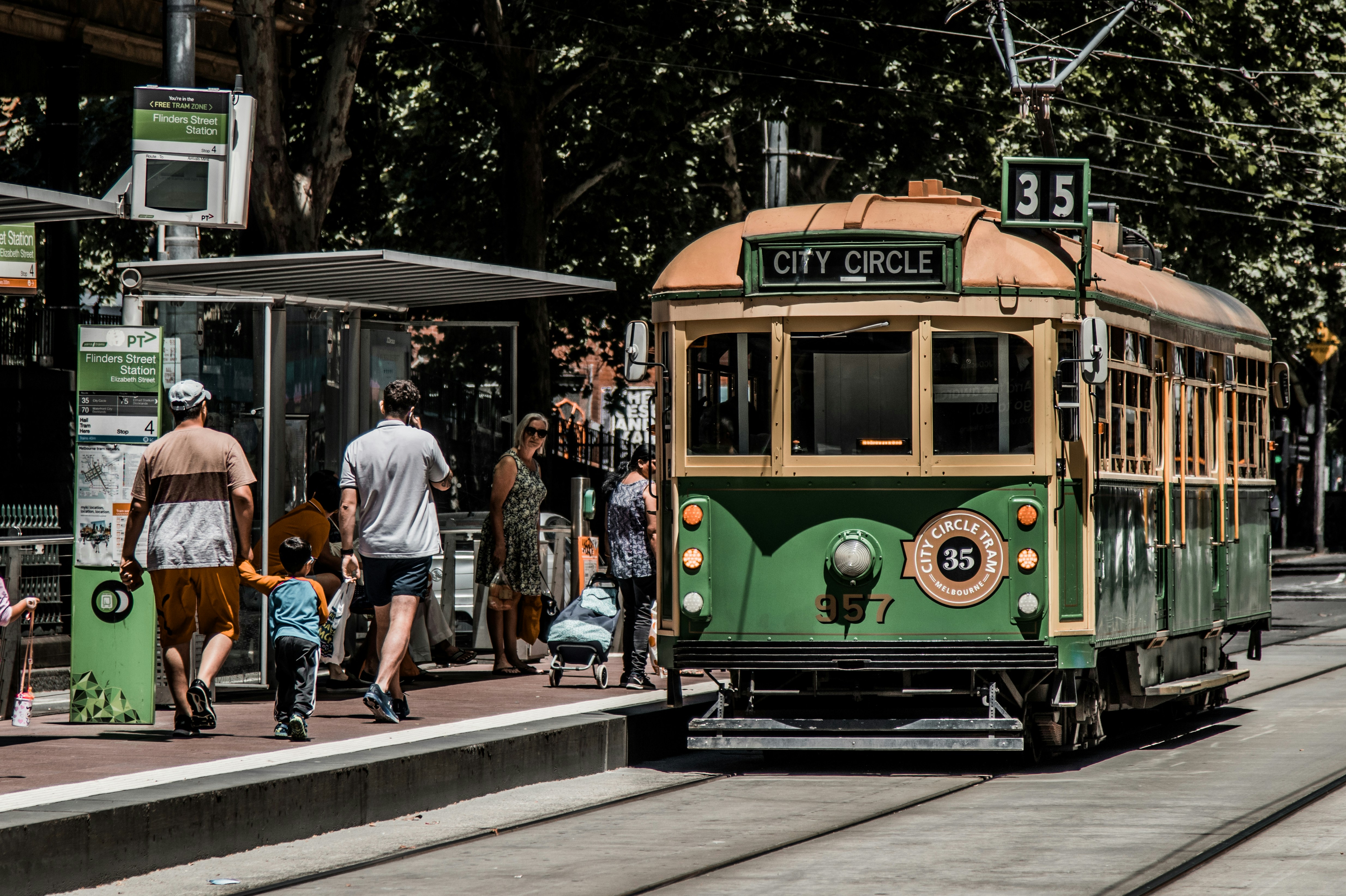 Spontaneous Melbourne street scene with trams and people