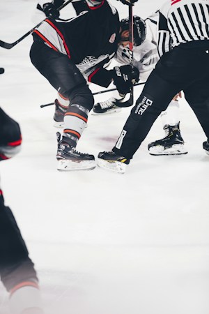 Ice hockey players battle for the puck during a game in a packed arena, the kind of scene fans expect as the Vegas Golden Knights open Season X