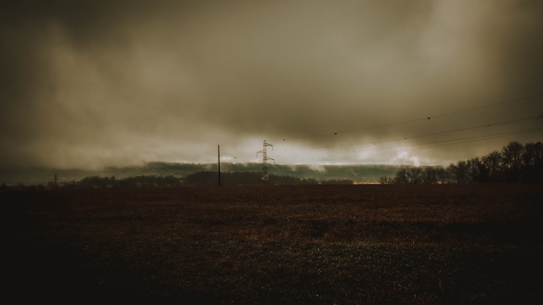 street light and plains under cloudy skies