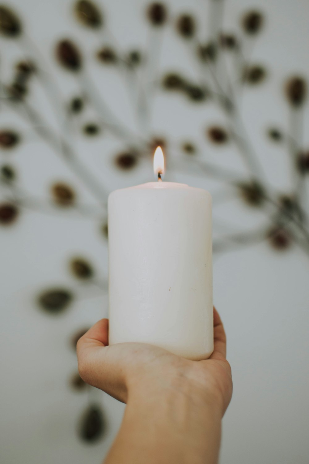 selective focus photography of lighted pillar candle