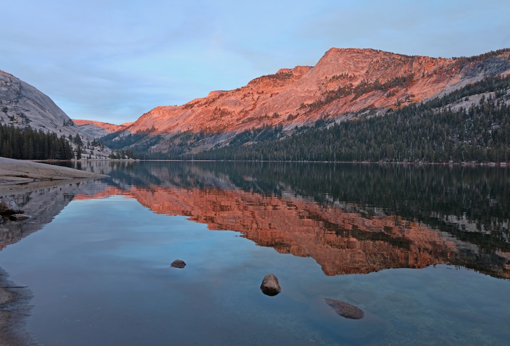 lake and mountains during day