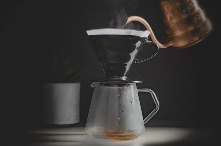 Pour-over coffee being brewed slowly over a dripper