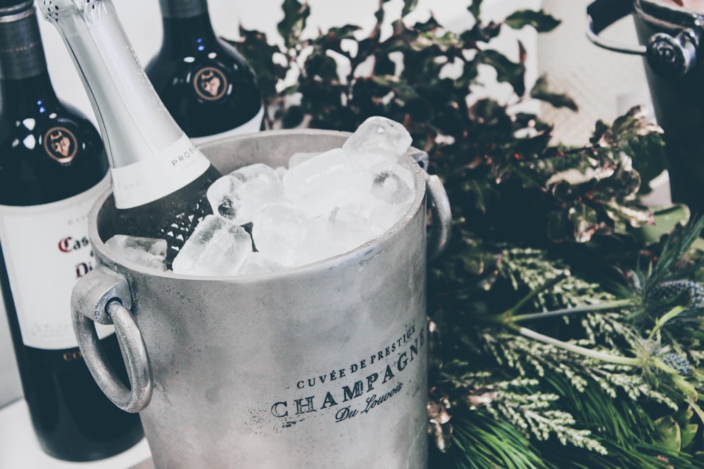 bottle on bucket filled with ice