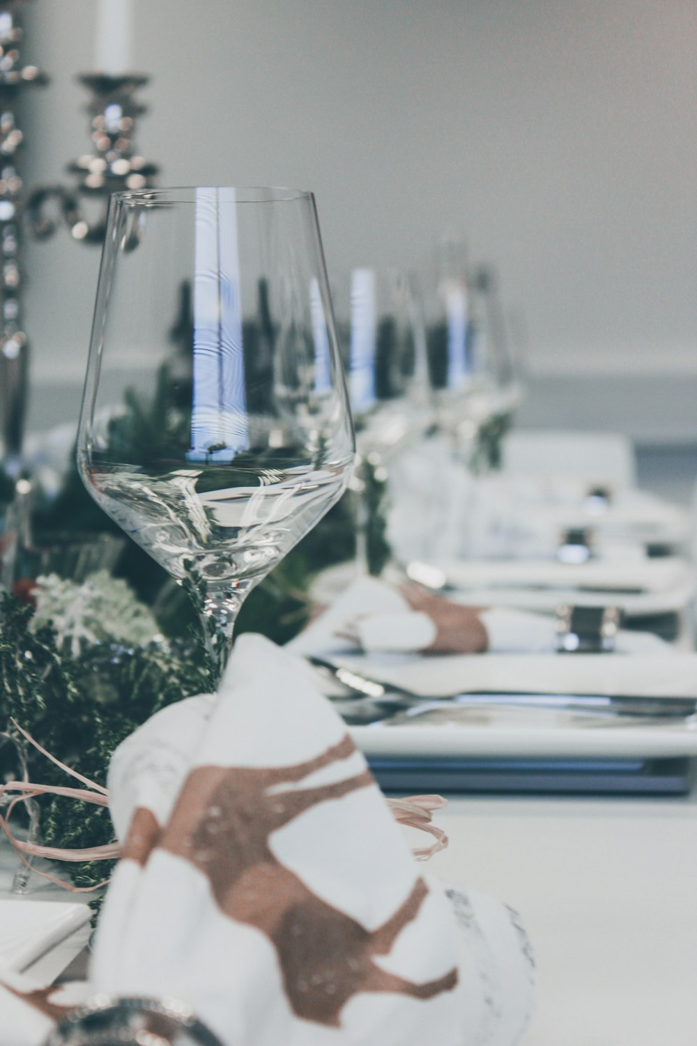 organized plates and drinking glass on table