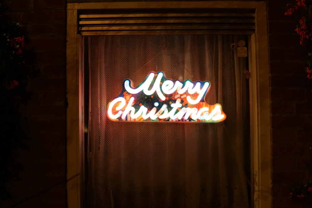 turned-on Merry Christmas neon light signage