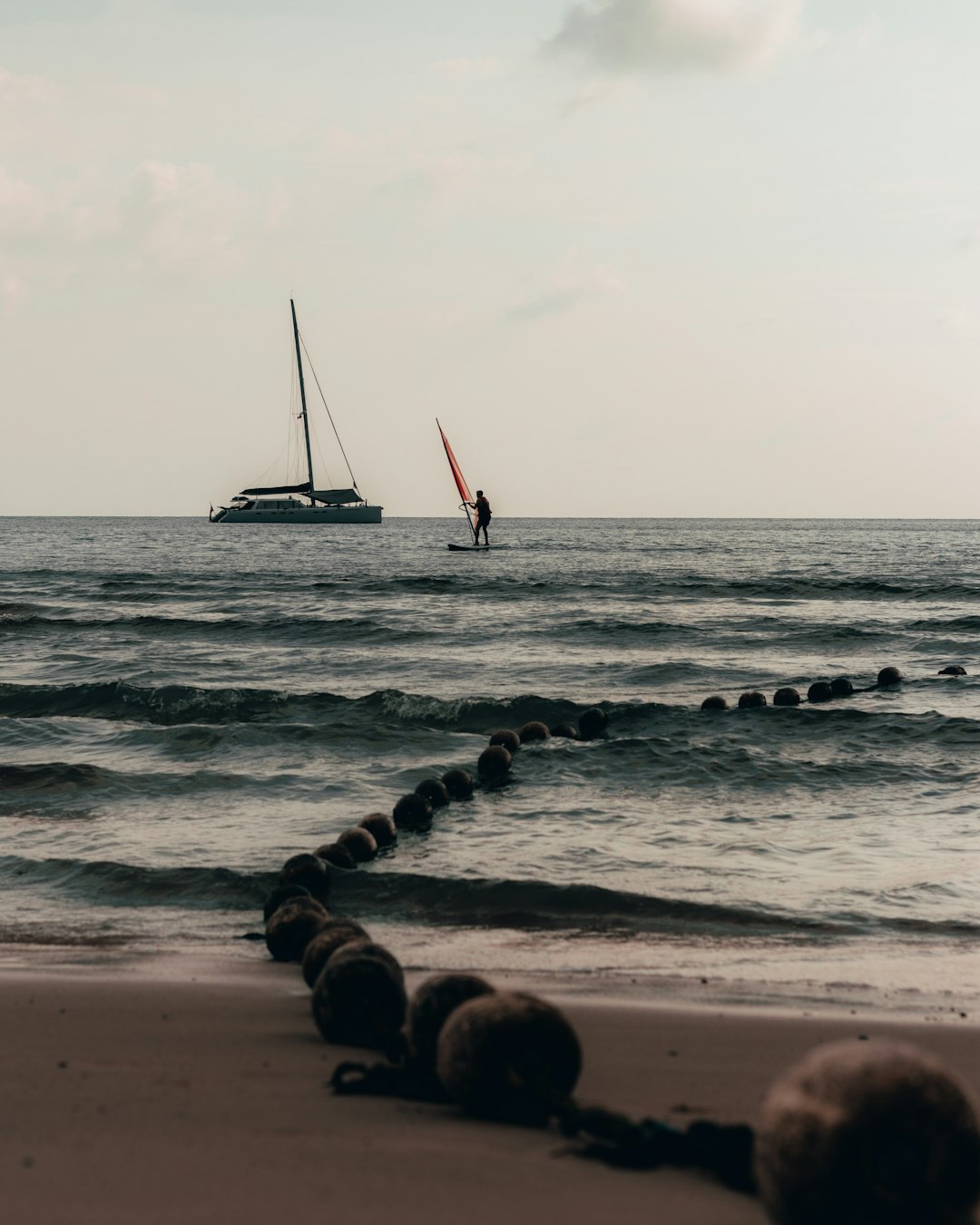 man standing on sailing boat