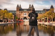 A scenic city photoshoot featuring iconic Amsterdam architecture on a crisp day.