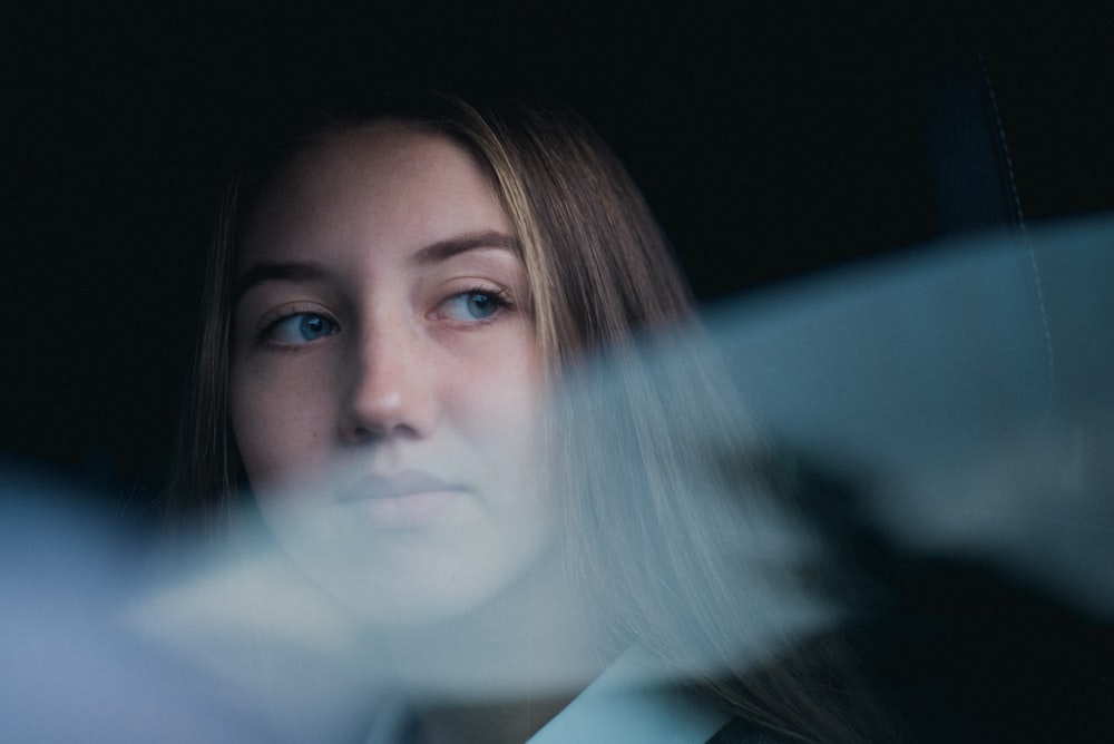 woman looking at window