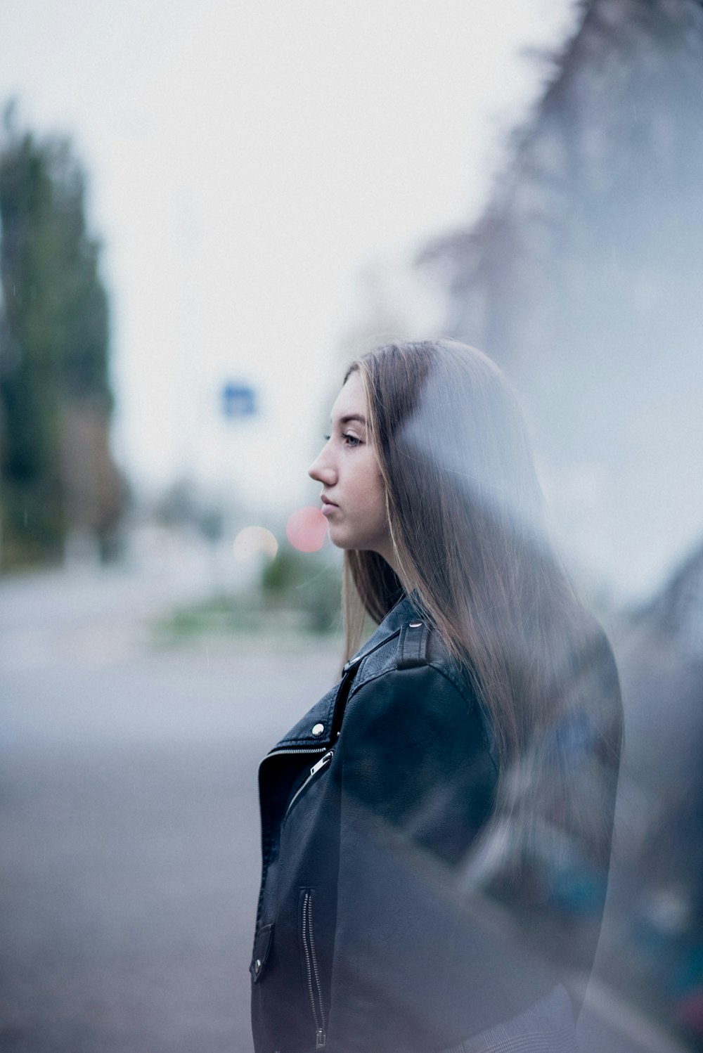 woman in black leather jacket