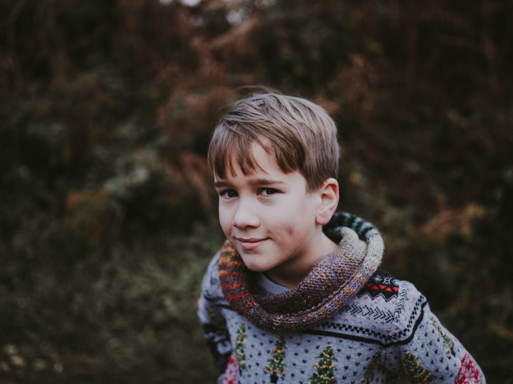 boy wearing blue top