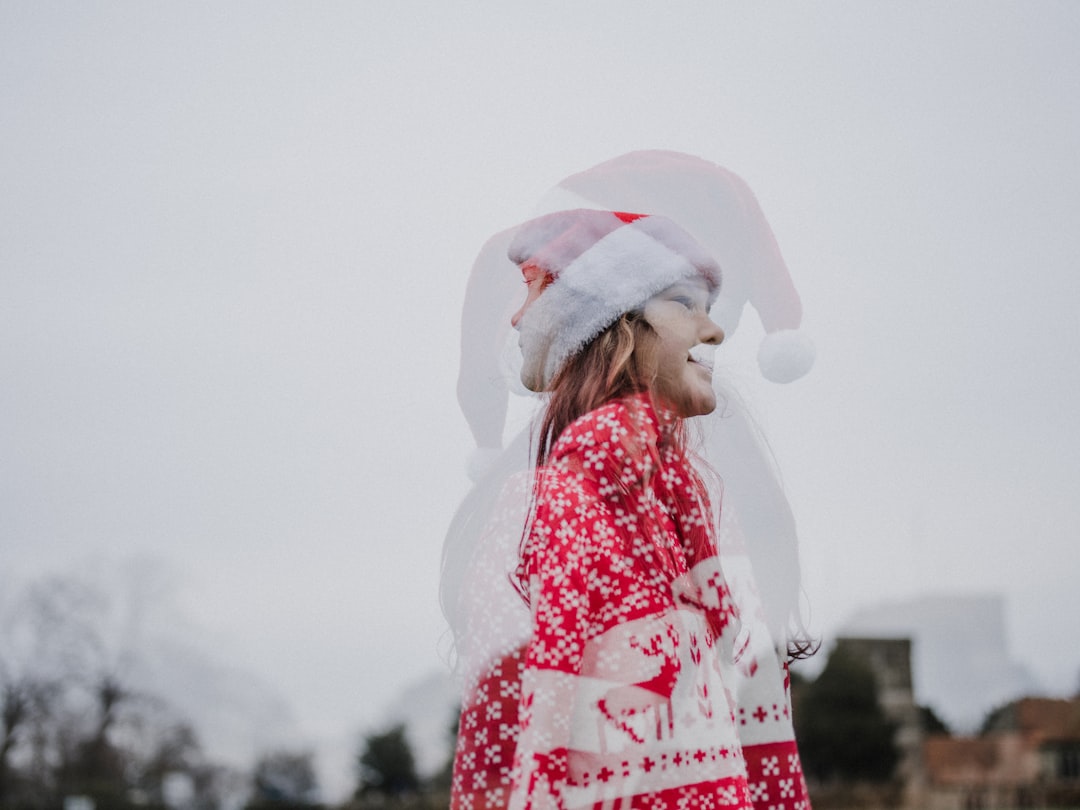 woman standing wearing red and white dress