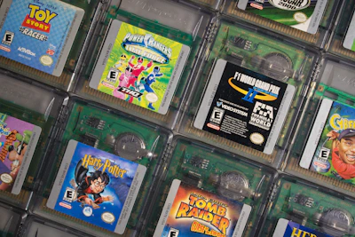 Close-up of vibrant custom-colored Game Boy Advance cartridge shells lined up.