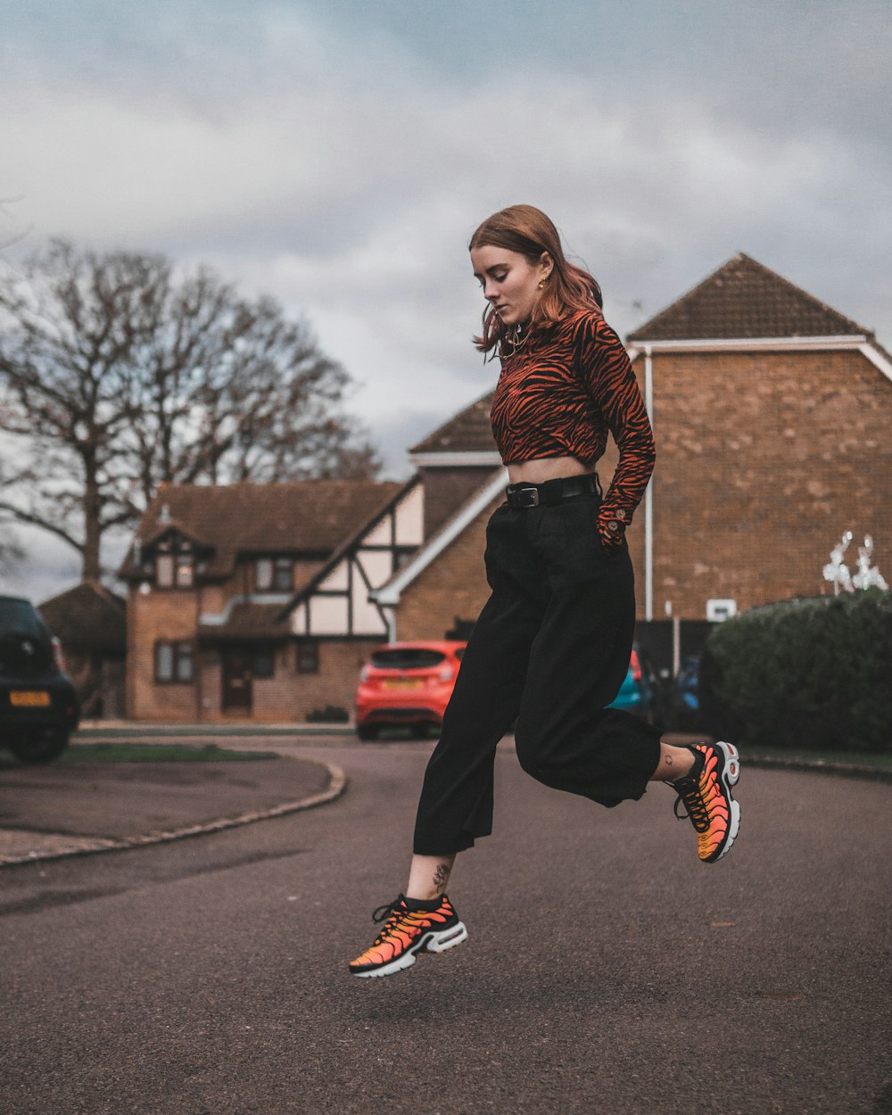 woman jumping on street