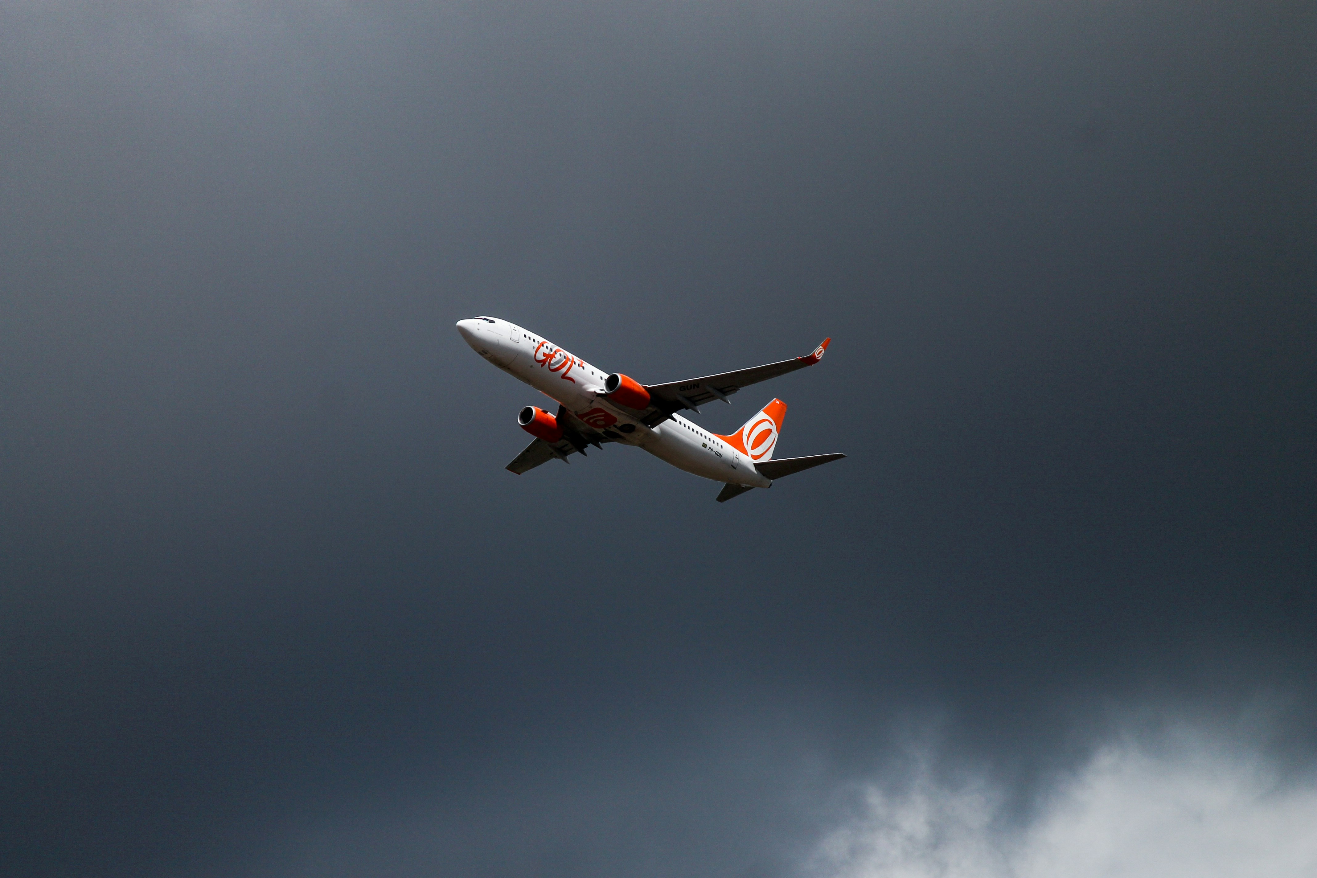 orange and white airliner on flight, 