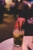 clear drinking glass with two straws
