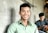 man standing beside wall