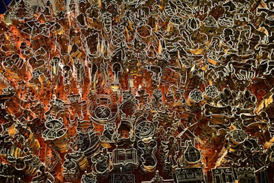 A vibrant image of various uniquely shaped baking molds arranged on an orange background.