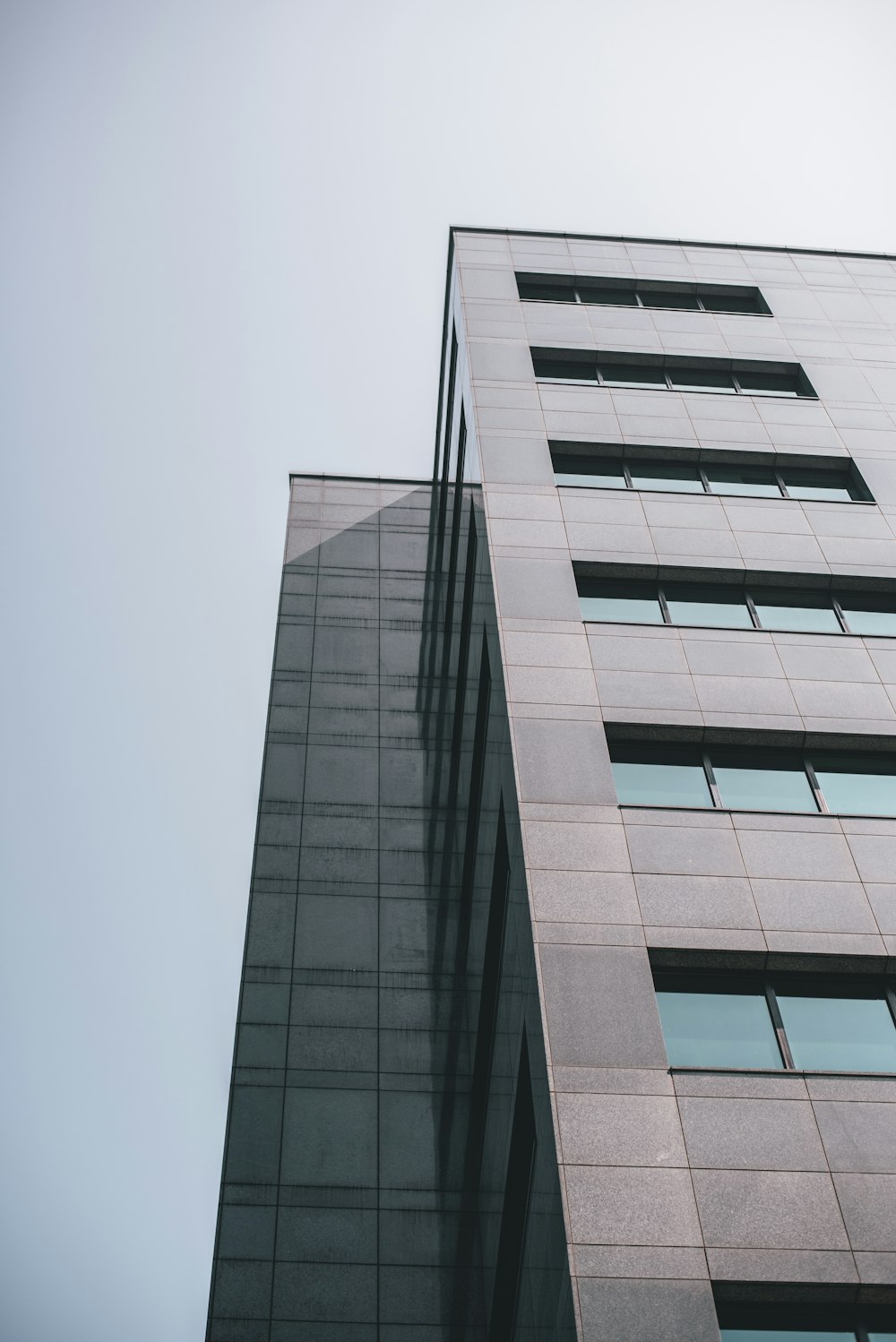 low-angle photography of gray building